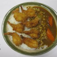 Shrimp Katsu Curry Rice  · Shrimp katsu, golden curry sauce and carrot on white rice. 