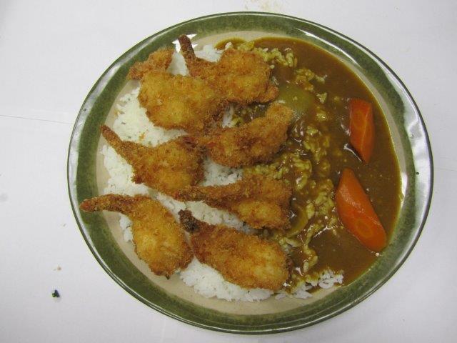 Shrimp Katsu Curry Rice  · Shrimp katsu, golden curry sauce and carrot on white rice. 