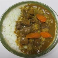 Beef Curry Rice  · Tendered beef dices, golden curry sauce and carrot on white rice. 