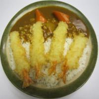 Shrimp Tempura Curry Rice  · Shrimp tempura, golden curry sauce and carrot on white rice. 