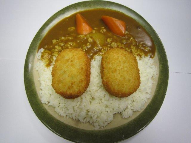 Vegetable Croquette Curry Rice  · Vegetable croquette with golden curry sauce on white rice. 