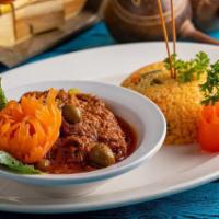 Ropa Vieja (Stewed Shredded Beef) · Tender beef brisket, boiled in its natural juices, shredded, marinated and cooked to perfect...