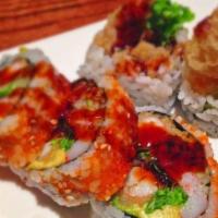 Dynamite Roll · Prawn tempura, avocado, cucumber, masago, and imitation crab meat.