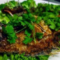 Crispy Whole Fish · Whole flounder deep-fried until crispy, topped with sweet, sour, and spicy sauce.