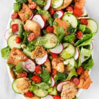 Fattoush Salad · Fresh romaine lettuce with tomatoes, cucumbers, mixed with toasted pita bread and house dres...