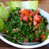 Tabbouli Salad · Fresh curly parsley, tomatoes, dry mint leaves, cracked wheat, tossed in lemon juice and oli...