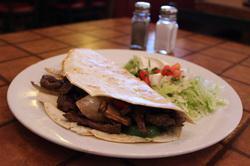 Fajita Quesadilla · Grilled steak or grilled chicken with onions, bell peppers, broccoli, and mushrooms in a flour tortilla served with a guacamole salad.