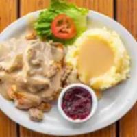 Hot Turkey Sandwich · Served on open-faced Texas toast with mashed potatoes and gravy and a side of cranberry sauce.