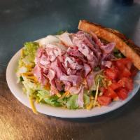 Chef's Salad · Ham, turkey, American, Swiss and tomato and a boiled egg.