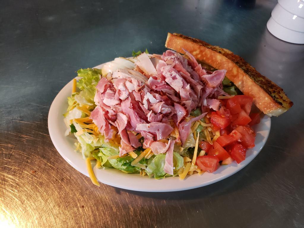 Chef's Salad · Ham, turkey, American, Swiss and tomato and a boiled egg.