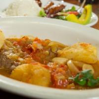 Carne a La Criolla · Beef stew in creole sauce. With rice, potatoes or yucca, salad, and sweet plantains.