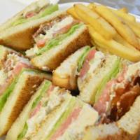 3. Tuna Fish Salad Club · With bacon, lettuce, tomato and mayo. Served with french fries and pickle.