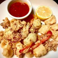 Fried Calamari · Golden fried calamari served with marinara sauce.