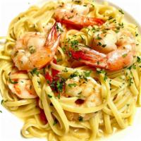 Shrimp Napoleon · 6 jumbo shrimp sauteed in a garlic butter, herbs and a touch of brandy over linguine.