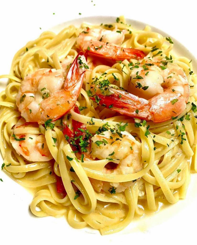 Shrimp Napoleon · 6 jumbo shrimp sauteed in a garlic butter, herbs and a touch of brandy over linguine.