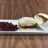 S4. Turkey Cranberry Sandwich · Lettuce, cranberry, cream cheese and turkey.