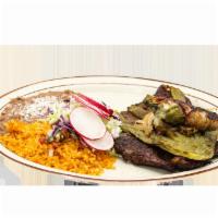 Carnitas Plate · Our delicious marinated carnitas plate. Served with beans, rice, hand-made tortillas, pico d...