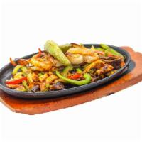 Fajitas Mixtas · Chicken,steak, and shrimp with sauteed bell peppers, onions, and tomatoes. Served with beans...
