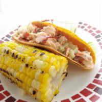 Lobster Taco · New England style lobster in a hard corn tortilla, served with a side roasted corn.