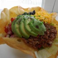 Taco Salad · Tortilla bowl filled with lettuce, pico de gallo, black beans, ground beef, cheddar cheese, ...