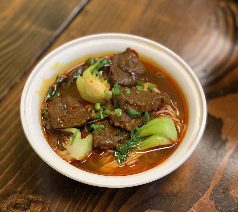 Braised Beef Noodle in Soup · Beef stew, chili pepper and bok choy.