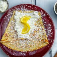 Lemon Sugar Crepe · Lemon juice, butter, ＆ sprinkled sugar topped with powdered sugar.