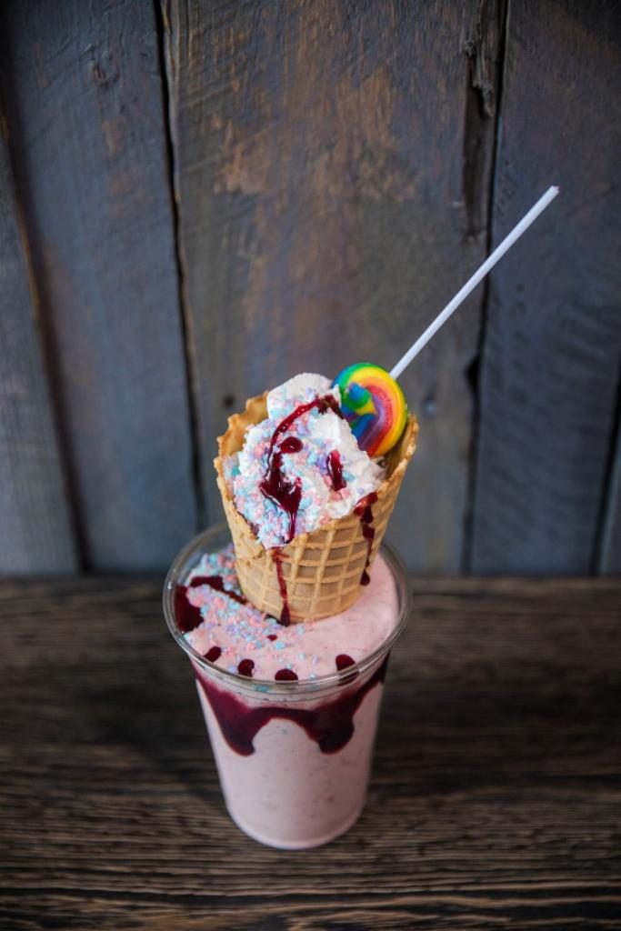 Firemans Carnival Shake · Strawberry shake. Cotton candy crunch, crushed waffle cone, swirl pop and  whipped cream.