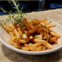 Drunken Poutine · A pie of french fries topped with Yancy Fancy cheddar cheese curds smothered with Guinness a...