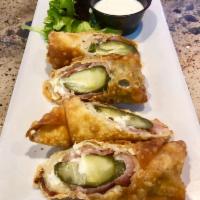 Crispy Pickle Poppers · Pickles stuffed with cream cheese, cheddar and jalapenos wrapped in bacon and rolled up in a...