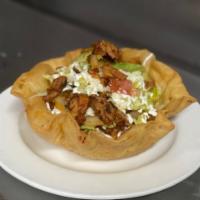 Carne Enchilada burrito Bowl · Flour Tortilla Sell with rice , Fried beans , meat of your choice, melted cheese, lettuce, s...