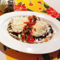 HUARACHE BREAKFAST  · OVAL CORN TORTILLA FILL UP WITH FRIED BEANS TOPPED WITH SALSA DE MOLCAJETE, CHORIZO, FRIED E...
