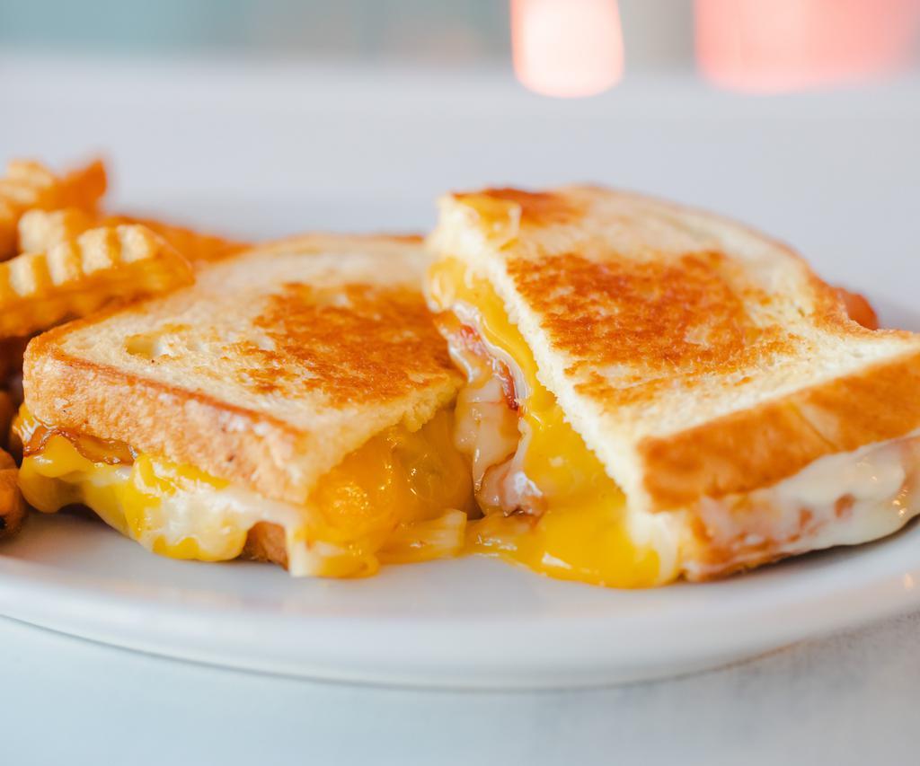 Ultimate Grilled Cheesiness · Pepper Jack cheese, Cheddar cheese, bacon, on your choice of Wheat or Sourdough bread