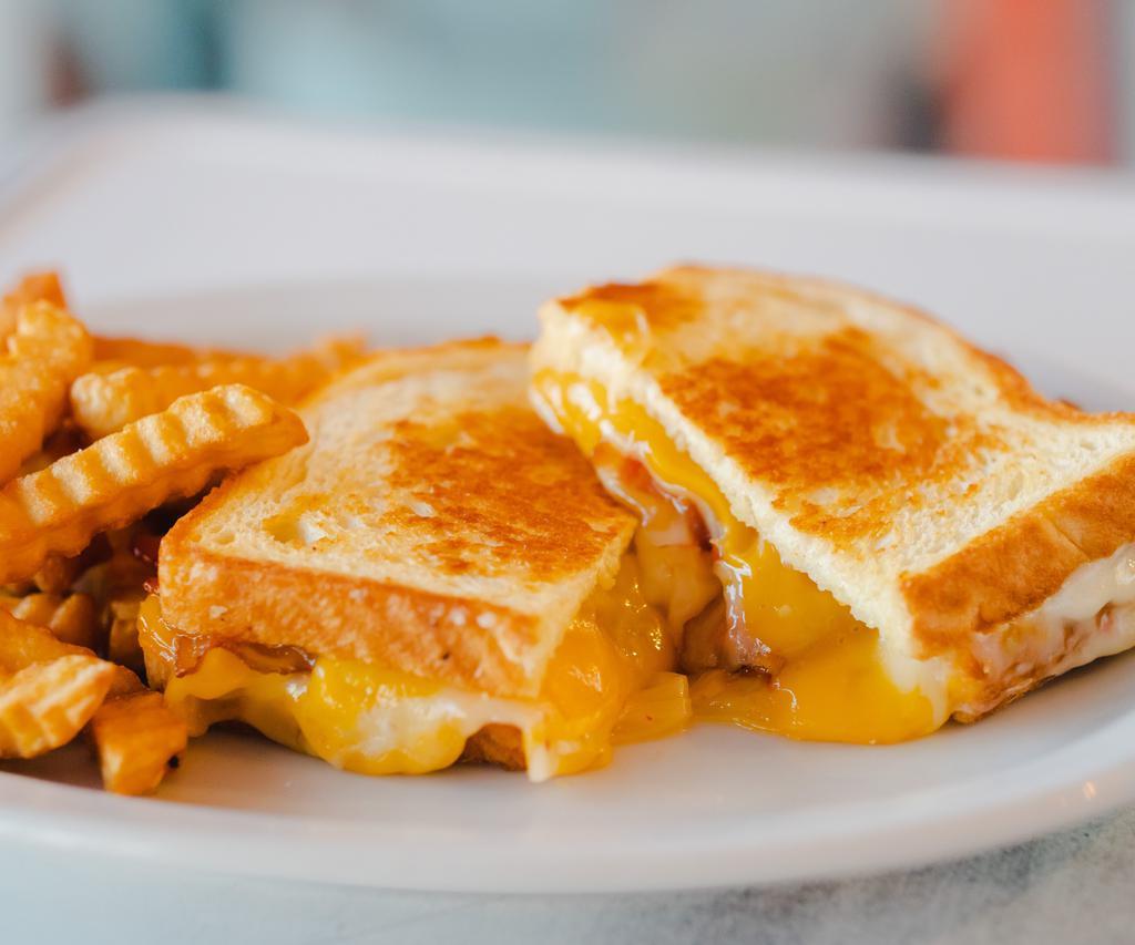 Kids Grilled Cheese Sandwich · Swiss Cheese, Cheddar Cheese on Toasted French Baguette.
