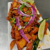 Chicken 555 · Boneless chicken breast pieces cooked with Indian spices.