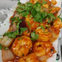 Chili Shrimp · Shrimp cooked in Manchurian style along with peppers.