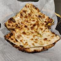 Paneer Naan · Leavened bread made in tandoor oven is stuffed with delicately spiced panner.