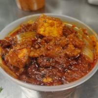 Kadai Paneer Curry · Cubes of cottage cheese simmered in a gravy of onions, tomatoes and peppers, along with roas...