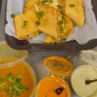 Spring roll Dosa · Thin crepe made with rice batter stuffed with spring vegetables.