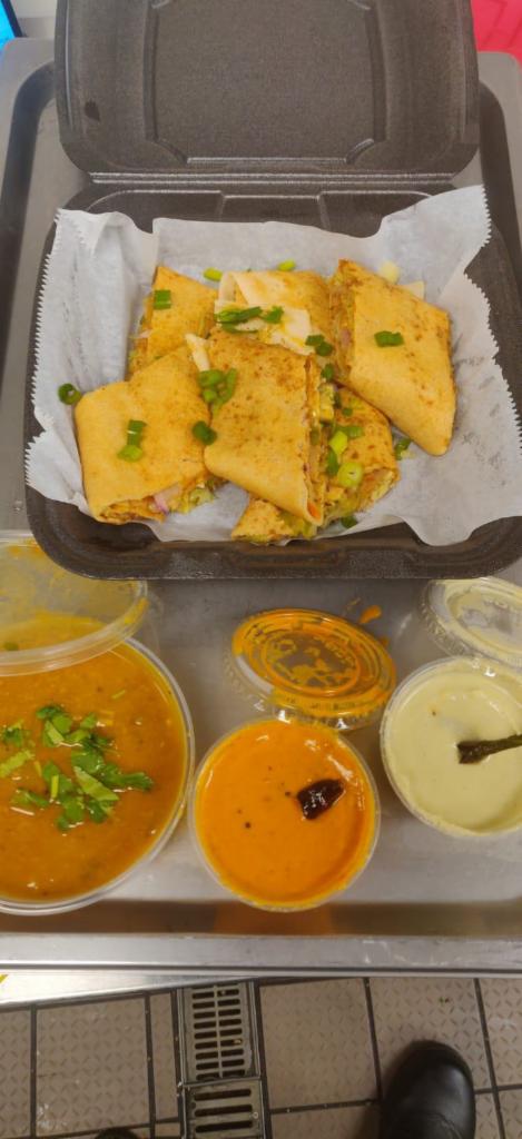 Spring roll Dosa · Thin crepe made with rice batter stuffed with spring vegetables.