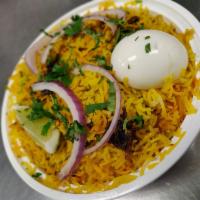 Vijayawada Boneless Biryani · Basmati rice cooked with boneless chicken, blended with herbs and spices then garnished with...