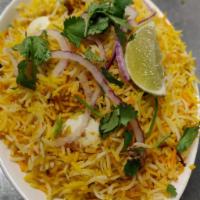 Egg Biryani · Basmati rice cooked with eggs, blended with herbs and spices then garnished with egg and ser...