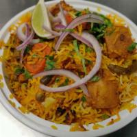 Vegetable Dum Biryani · Basmati rice cooked with a variety of fresh seasonal vegetables, blended with herbs and spic...