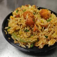 Chicken Fried Rice · Steamed rice stir fried on a wok along with chunks of chicken and freshly chopped vegetables...
