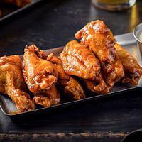 Chicken Wings · choice of bbq with ranch or honey sriracha with stilton dressing.
