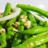 Salt N Pepper Garlic Green Beans · House salt and pepper mix tossed with green beans, onions, topped with garlic fried garlic c...