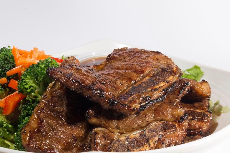 Korean Beef Short Ribs · Premium beef short ribs are marinated with a sweet-ginger soy sauce. Served with steam veggies and a side of teriyaki dipping sauce.Served with steamed Rice. (Gluten-free)