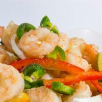 Salt N Pepper Shrimp · Crisp flash-fried shrimp are wok-tossed with sliced onions, jalapenos, and seasoned with hou...