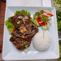 7C. Com Suon Heo Nuong - pork chop · Grilled pork chop plate.