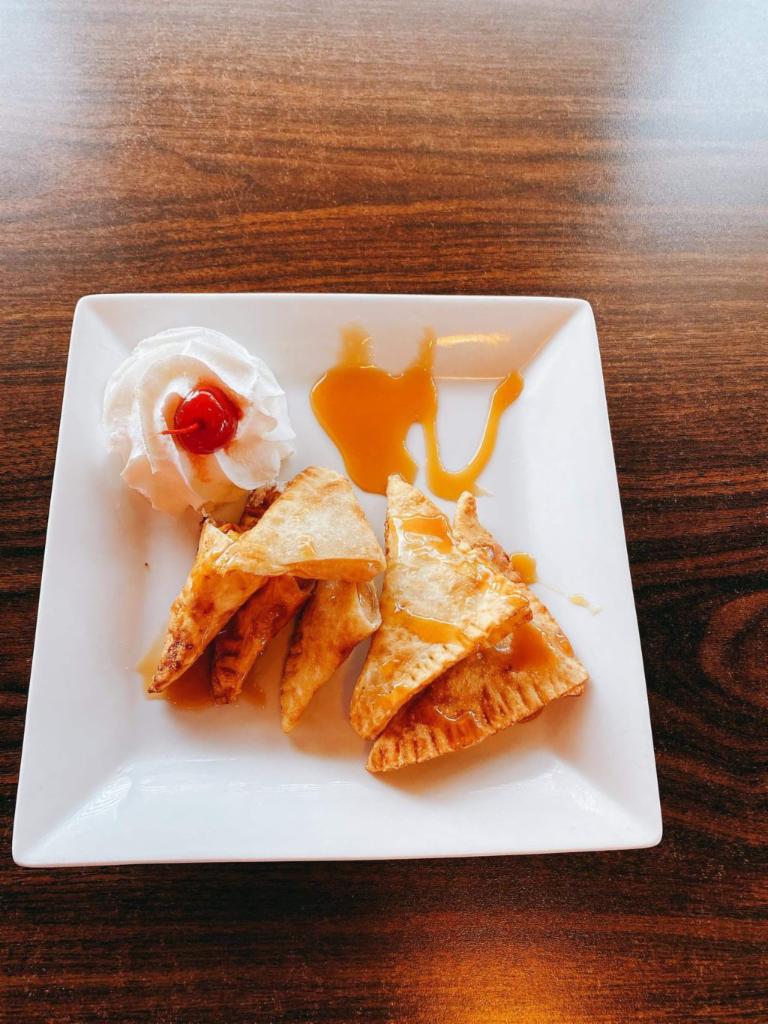 Apple cherry pie wonton  · Apple cherry pie filling , served with caramel sauce 