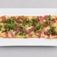 Fromage Flatbread · A blend of artisan cheeses, fresh basil and garlic olive oil.